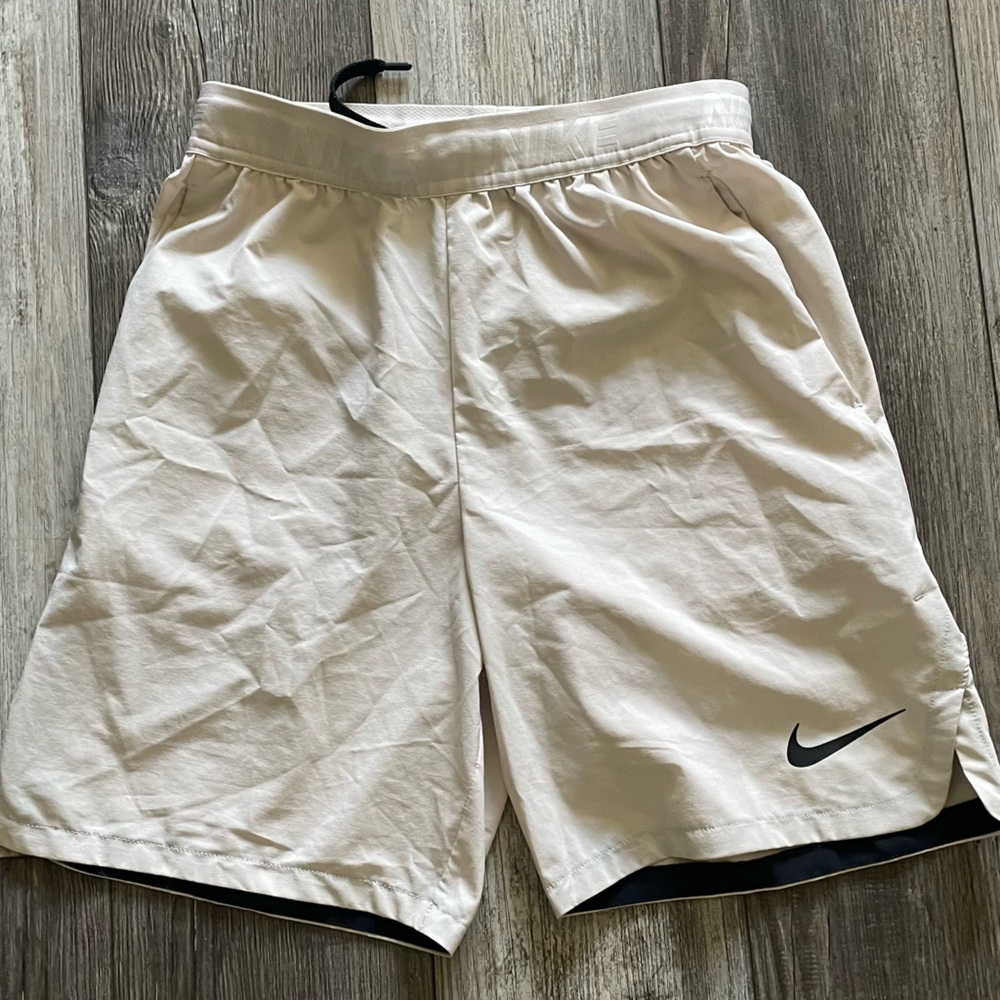 Nike training / running shorts. Color beige, size small.